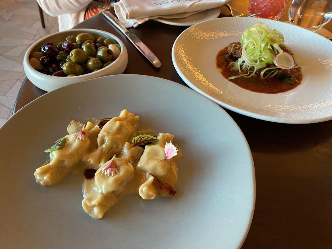 Three plates of food on a table. All are small finger food appetizers