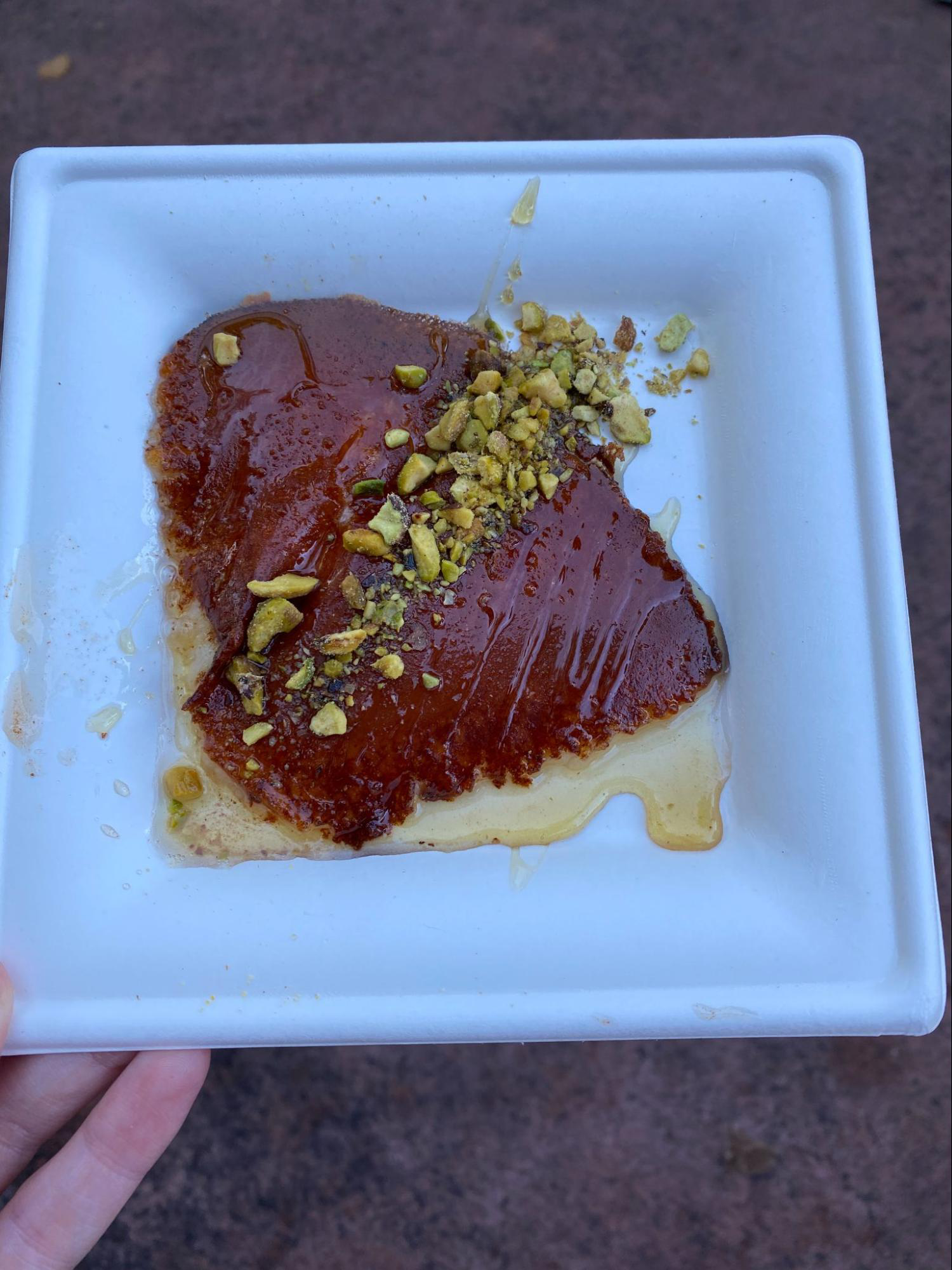 A photo of a plate with brown griddled cheese
